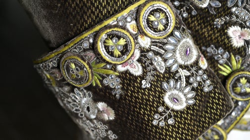 A decorative sleeve on a coat in the costume collection at Calke Abbey Derbyshire
